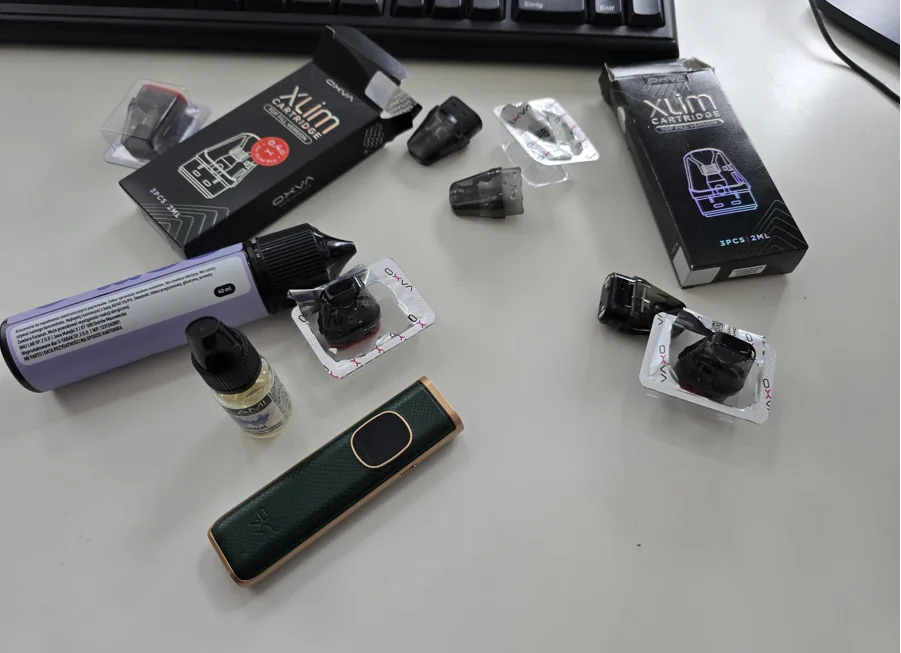 OXVA vape and pods on a table